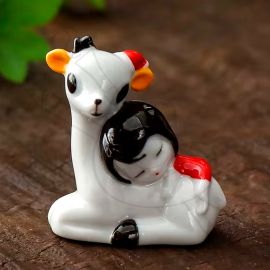 POSA PINCEL DE PORCELANA VENADO CON NIÑA